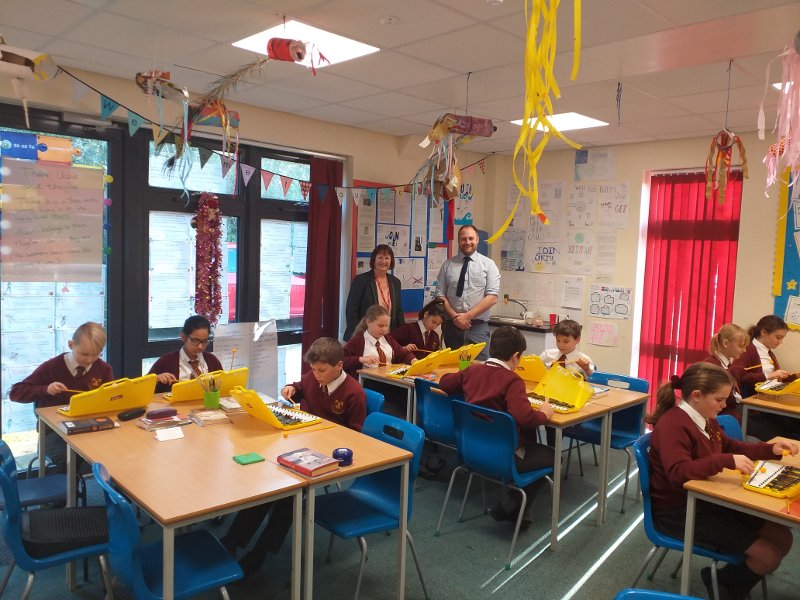 Pupils from Year 6 are pictured enjoying the instruments with the Headteacher Mr Ricky Emms and
Trustees Linda Scott OBE 